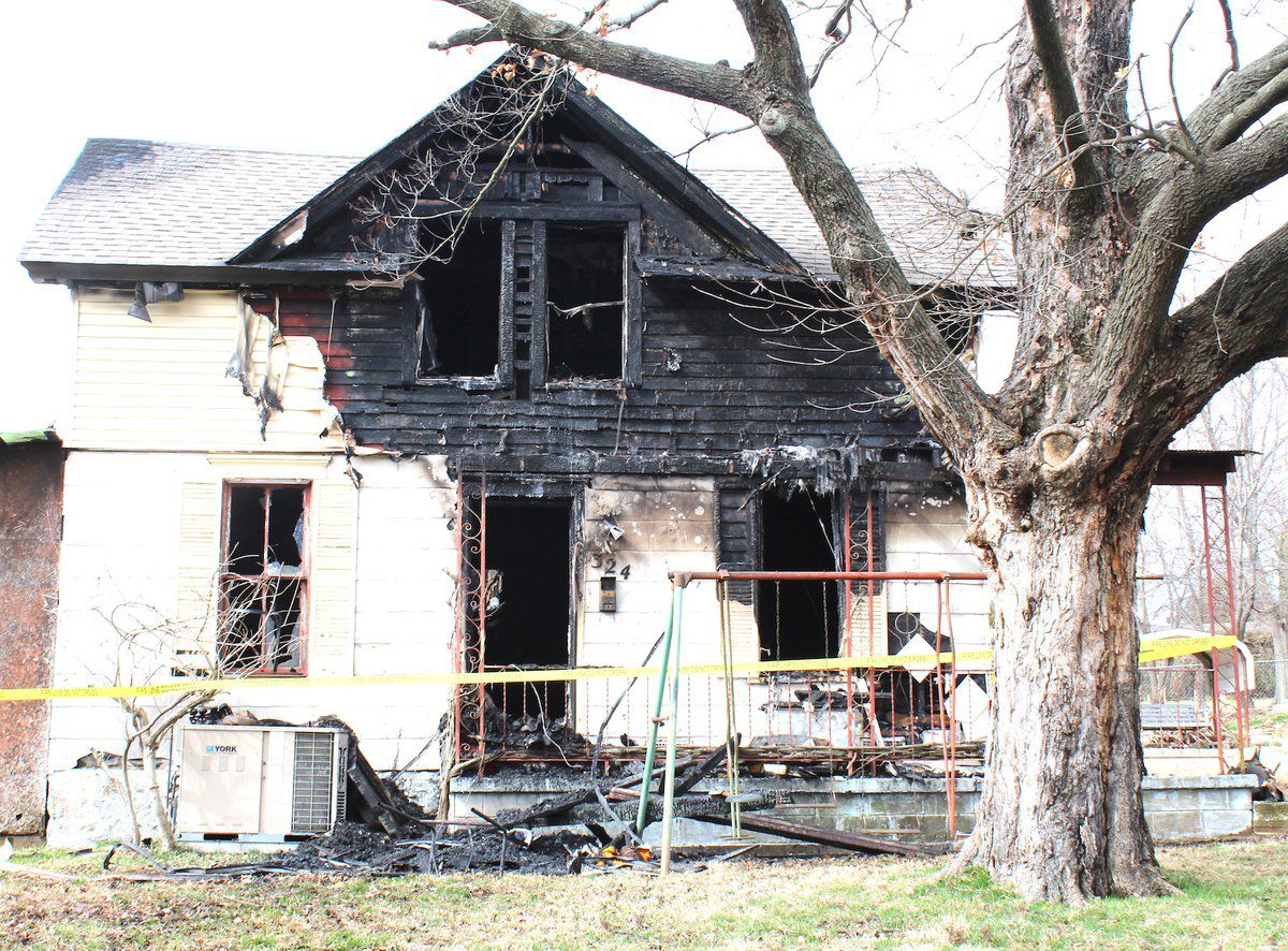 Condition of woman who lived in burned house unconfirmed